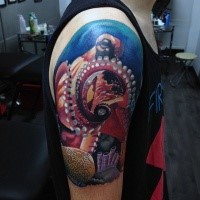 Fantastic looking colored creative upper arm tattoo of large orctopus