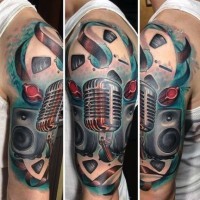 Fantastic painted 3D like music themed half sleeve tattoo