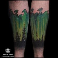 Fantastic painted and colored arm tattoo of night glowing sky with forest