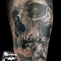 Fantastic painted very realistic black and white skull with bullets tattoo on arm