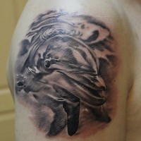 Fantastic very detailed big black and white dolphin tattoo on arm top