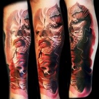 Fantasy style colored arm tattoo of Impressive looking woman with human skull
