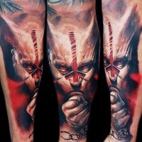 Fantasy style colored arm tattoo of cool looking demonic man