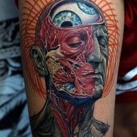 Fantasy style colored arm tattoo of human face with organs