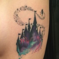 Fantasy style colored Disney castle tattoo with Tinkerbell