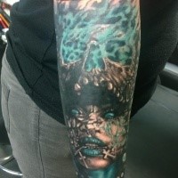 Fantasy style colored hand tattoo of burning skull with woman face