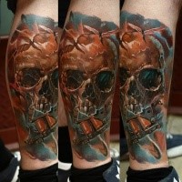 Fantasy style colored leg tattoo of corrupted human skull