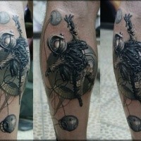 Fantasy style colored leg tattoo of space man with roped planets