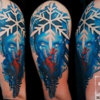 Fantasy style colored shoulder tattoo of mystic woman face with snowflake