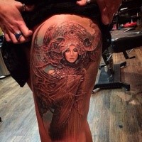 Fantasy style colored thigh tattoo of beautiful woman