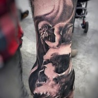 Fantasy world like big black and white monster with skull tattoo on arm