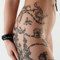 Fantasy world like original painted tattoo with animals and lettering in thigh