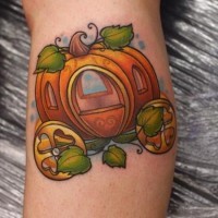 Fantasy world style little cute colored pumpkin coach tattoo on leg