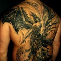 Fearful demon with great wings tattoo on back