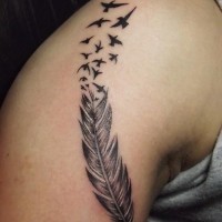 Feather and flock of birds tattoo