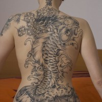 Fish and lotus flowers tattoo on back for girls