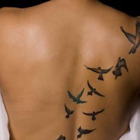 Flock of birds tattoo on the back