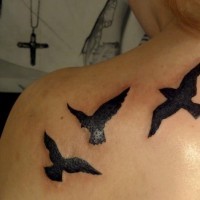 Flying black birds tattoo on back shoulder