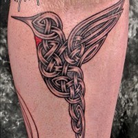 Flying hummingbird stylized with knot design tattoo