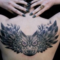Flying patchwork owl tattoo on back