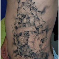 Frigate in sea tattoo on ribs