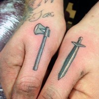 Funny 3D like tiny medieval axe and sword tattoo on fingers