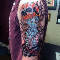 Funny cartoon like multicolored jellyfish tattoo on shoulder with skull
