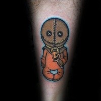 Funny cartoon style colored evil doll with lollypop tattoo on forearm
