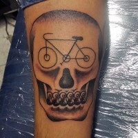 Funny designed back and white bicycle themed tattoo with skull on leg