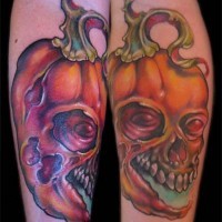 Funny designed colored and detailed forearm tattoo of skull shaped pumkin