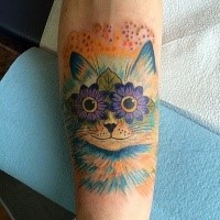 Funny fairy tale cat with floral eyes bright colored detailed forearm tattoo