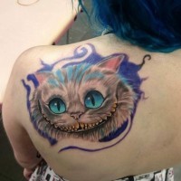 Funny fairy tale smiling Cheshire cat colored detailed upper back tattoo with violet paint shadow