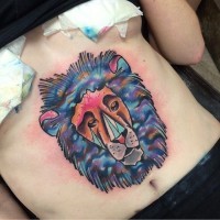 Funny fantasy style colored lion face tattoo on belly