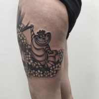 Funny little cartoon cat tattoo on thigh