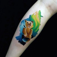 Funny little multicolored bear tattoo on arm
