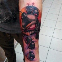 Funny looking colored forearm tattoo of crazy bombs