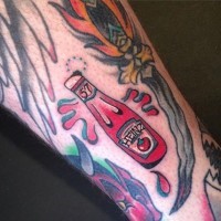 Funny looking colored Heinz ketchup bottle tattoo on leg