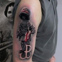 Funny looking colored shoulder tattoo of small toy soldier