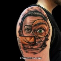 Funny looking colored shoulder tattoo of man portrait