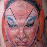 Funny looking colored ugly woman face tattoo