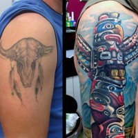 Funny multicolored tribal statue shoulder length tattoo