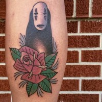 Funny old school style cartoon monster tattoo on leg with flower