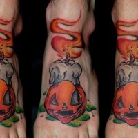 Funny painted colored burning candle tattoo on foot with pumpkin