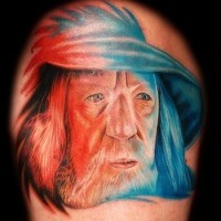 Funny painted colorful natural looking shoulder tattoo of Gandalf wizard