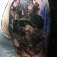 Funny realistic looking dog in sun glasses arm tattoo