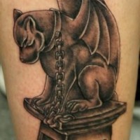 Gargoyle dog with a chain around neck tattoo