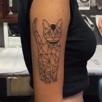 Geometrical style black ink shoulder tattoo of cat with green eyes