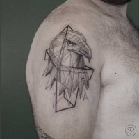 Geometrical style black ink shoulder tattoo of eagle head