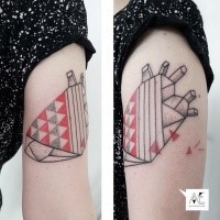 Geometrical style colored arm tattoo of human heart with ornaments