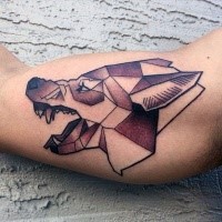 Geometrical style colored biceps tattoo of wolf head